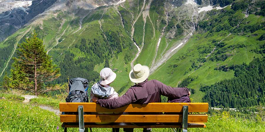 Hikers taking a break on a bench. 